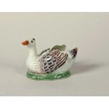 A Delft duck butter tub cover, 18th century, modelled as a duck with wings slightly extended and