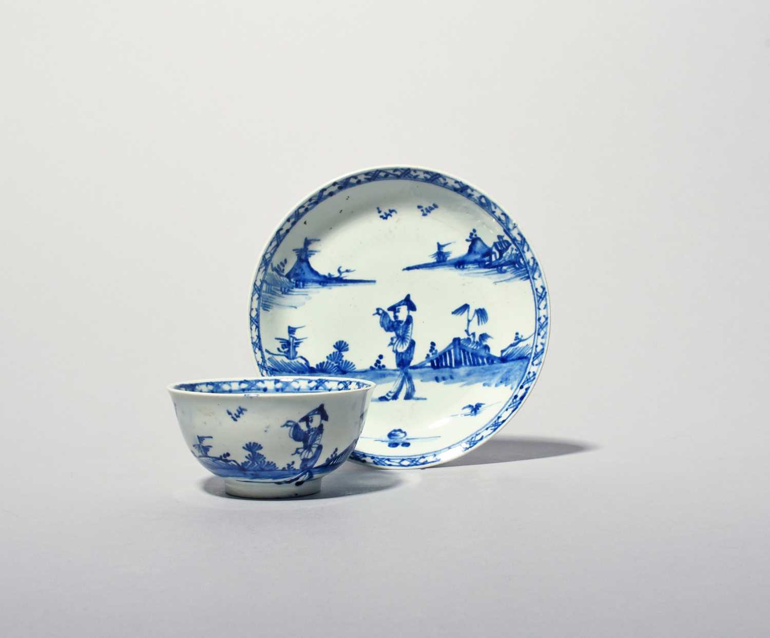 A Vauxhall blue and white teabowl and saucer, c.1755, painted in a strong blue with a Chinese figure - Image 2 of 2