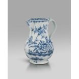 A large and early Lowestoft ale or cider jug, c.1760-62, finely painted with a large spray of