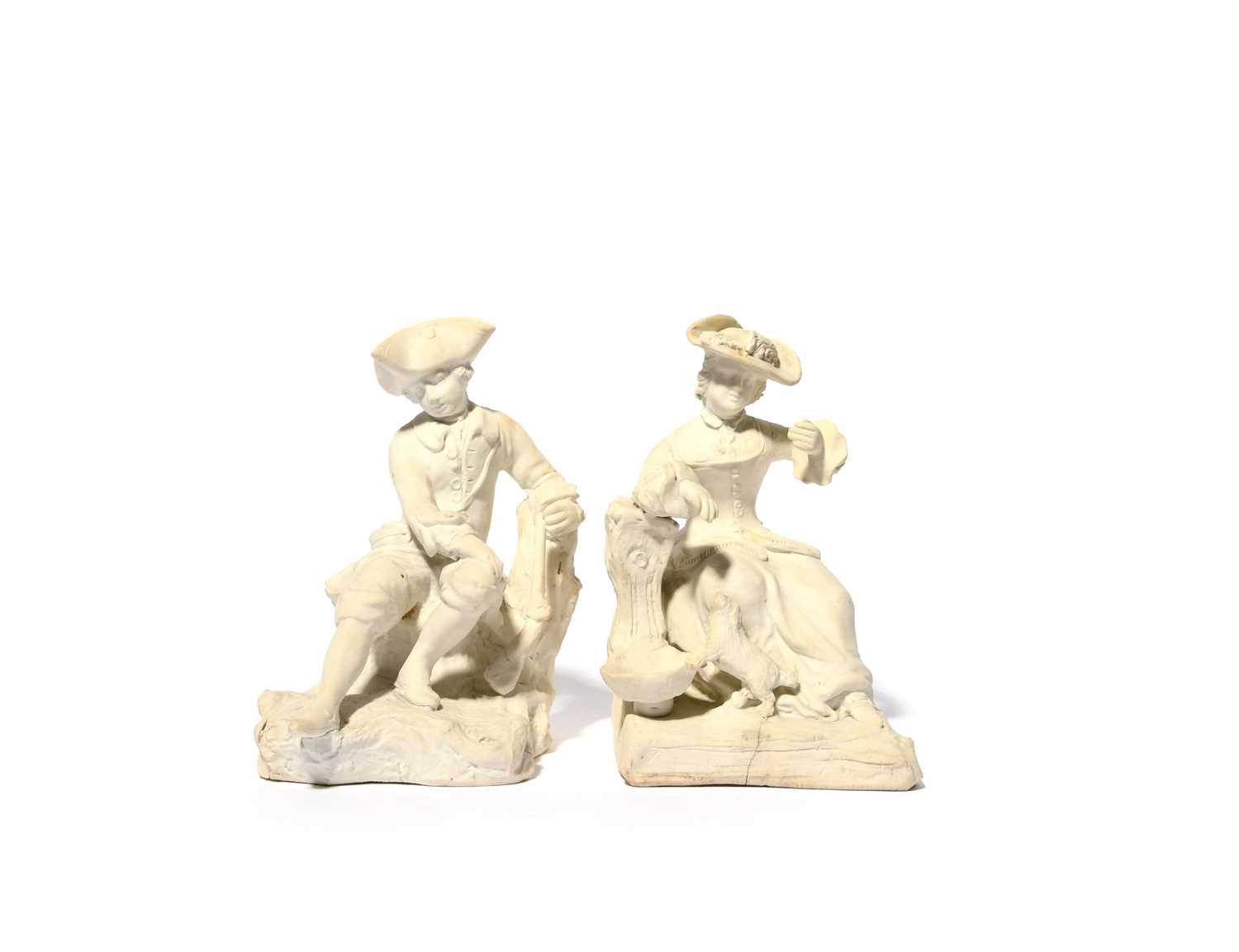 A pair of early Bow biscuit porcelain figures of a huntsman and his companion, c.1752-53, he