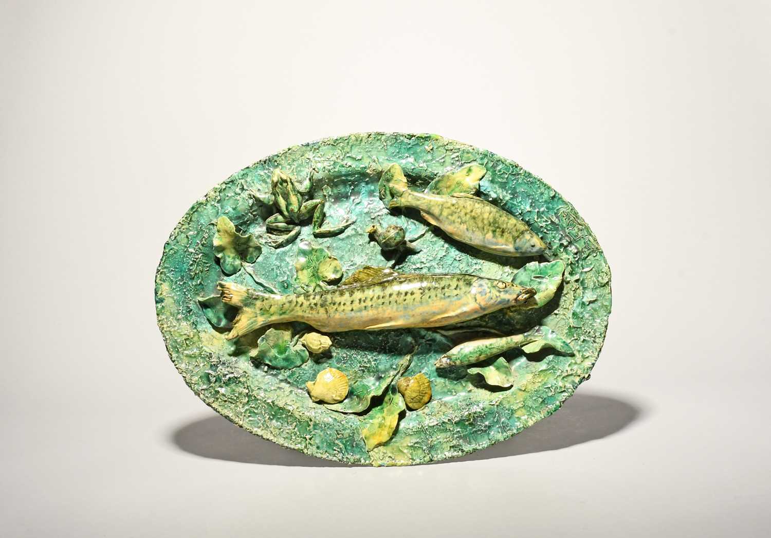 A large French Palissy-style majolica trompe l'oeil dish, c.1880, the oval form modelled in high