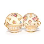 Two Nantgarw teacups and saucers, c.1815-18, painted with sprays of rose and other garden flowers