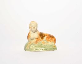 A rare Pratt ware figure of a sphinx or other mythical creature, c.1800, modelled with the head