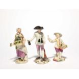 Three German porcelain figures of traders, 18th century, one Frankenthal of a beer seller,