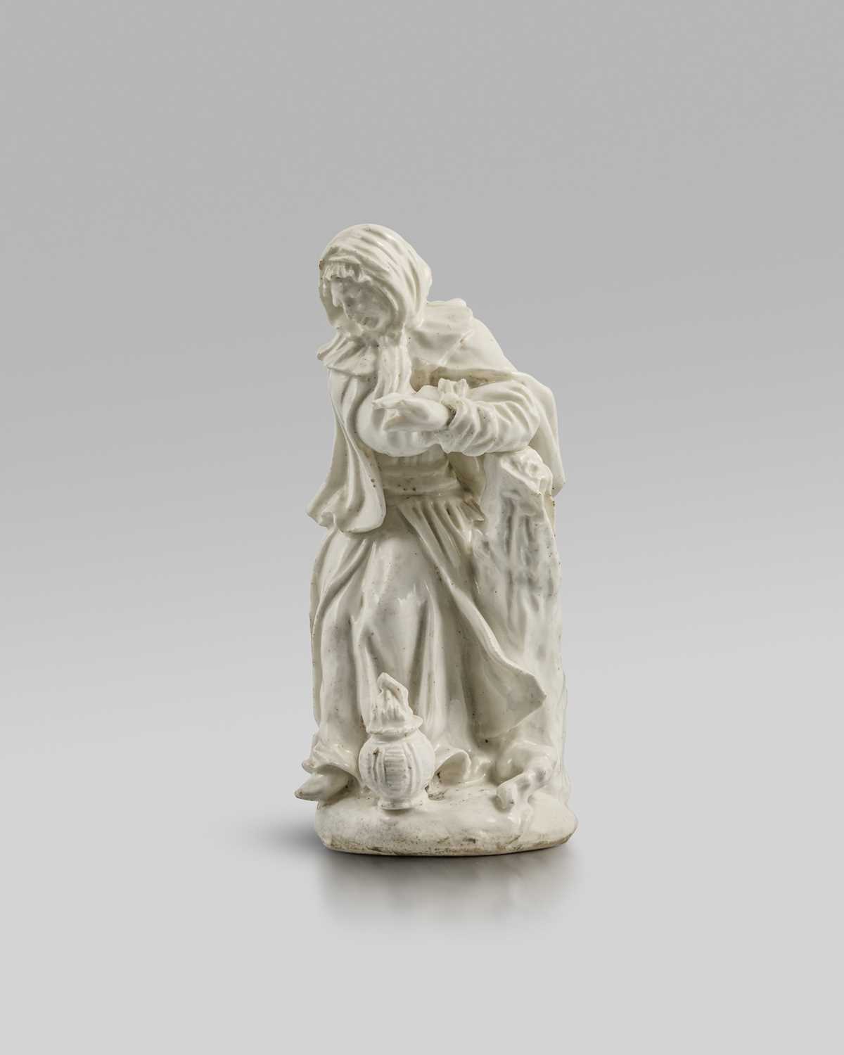 A Derby white-glazed 'dry-edge' figure of Winter, c.1752-55, modelled by Planché as a woman