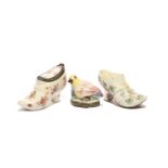 Three French porcelain bonbonnieres, c.1740, two St Cloud and modelled as buckled heeled shoes,