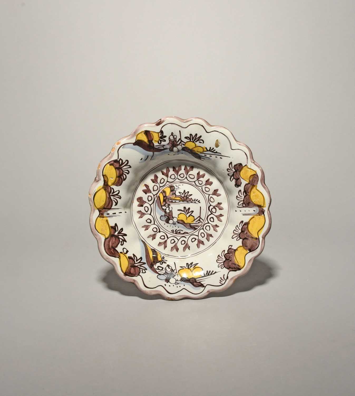 A rare Brislington lobed dish, c.1680, unusually painted in a three-colour palette with manganese,