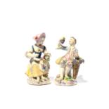 A matched pair of Bow figures of grape sellers or vintners, c.1760, modelled as a boy and girl