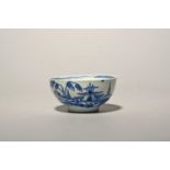 A small Vauxhall blue and white bowl, c.1758-60, painted with a pagoda beside an ornamental fence