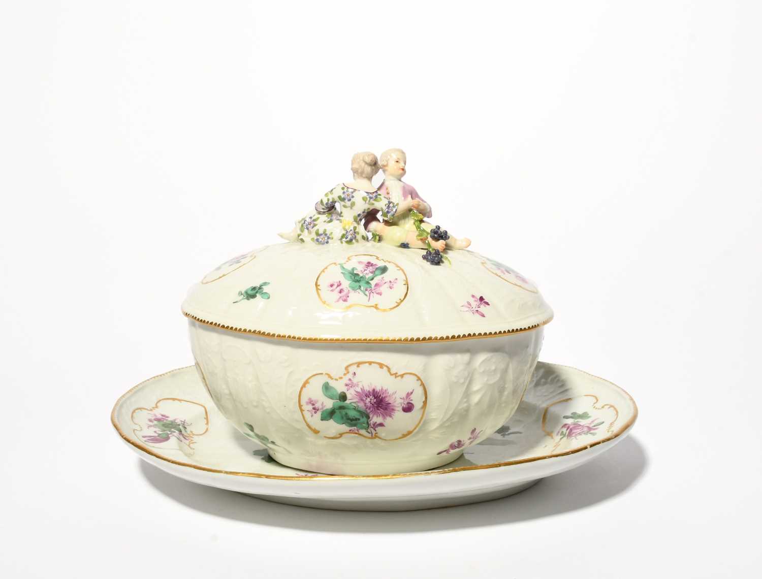 A Meissen oval tureen with cover and stand, mid 18th century, moulded with rococo floral panels,