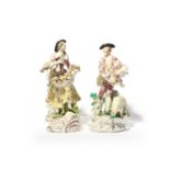 A large pair of Bow figures of a shepherd and his companion, c.1760, he with bagpipes tucked under