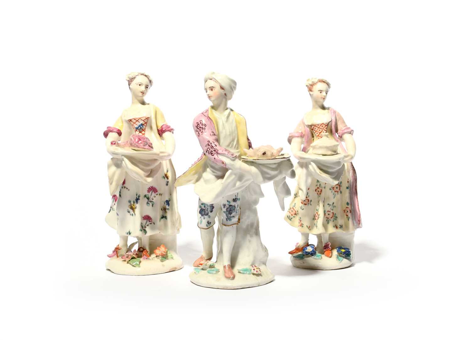 A Bow figure of the Poultry Chef and two Bow figures of female cooks, c.1755, the former holding a
