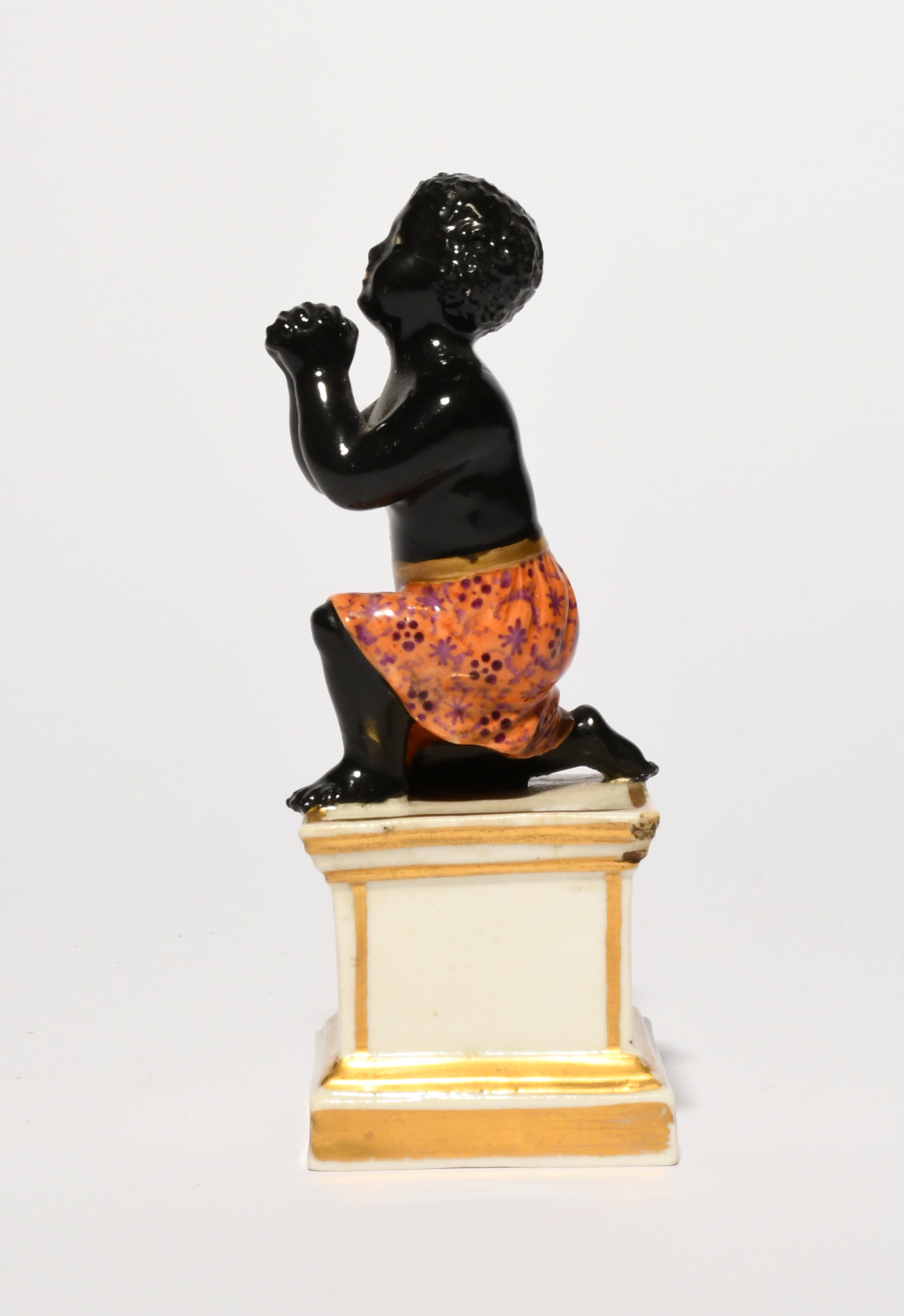 A rare Derby anti-slavery figure, early 19th century, modelled as a young black slave on one knee - Image 4 of 5