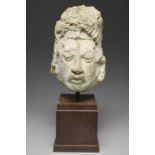 A Maya stucco headMexico, circa 250 - 750 ADthe finely modelled face with a roughly modelled