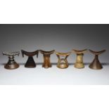 Six Ethiopian headreststhree with incised decoration and one with aluminium mounts,15cm - 17.5cm