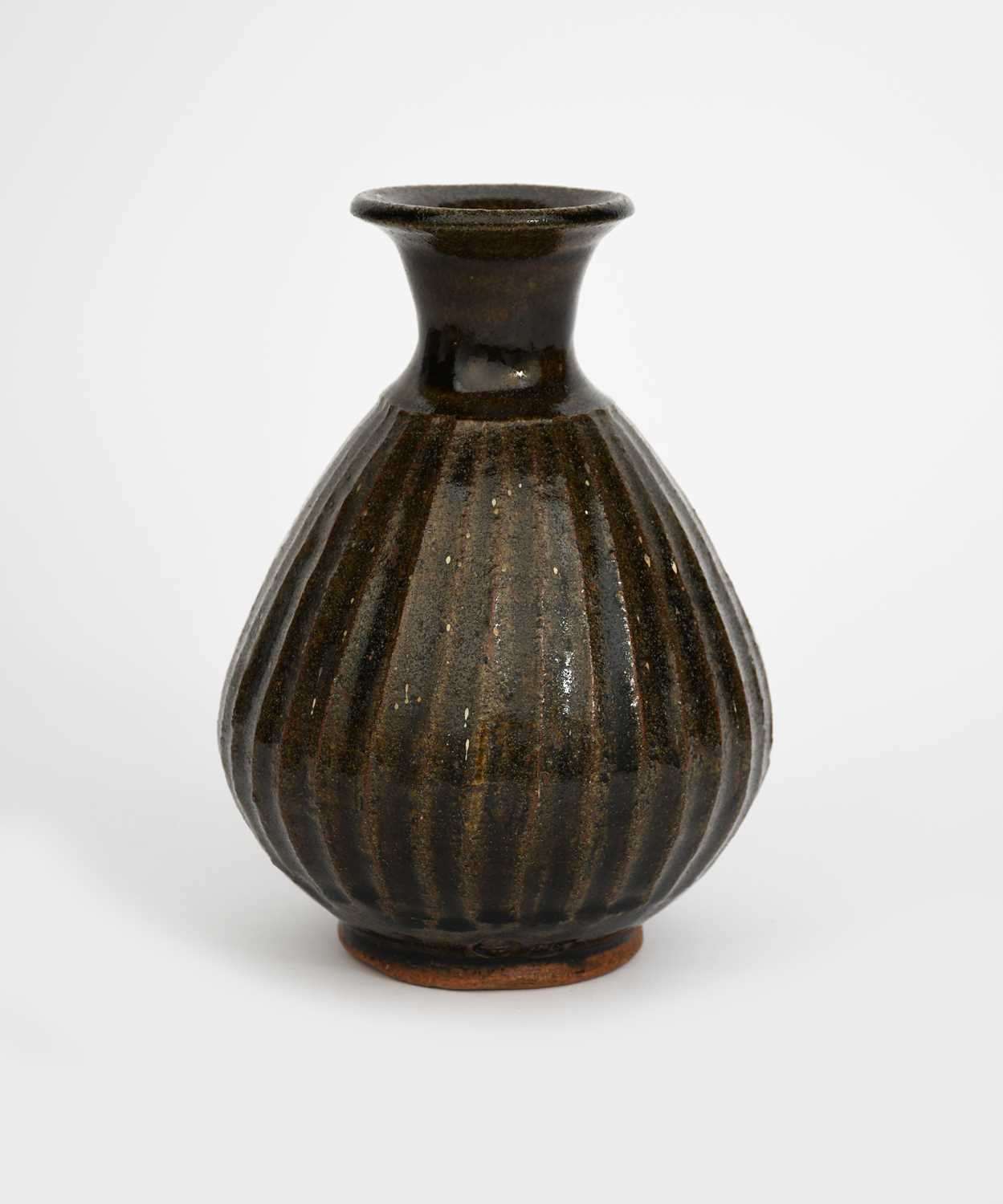 ‡ Bernard Leach CBE (1887-1979) a stoneware bottle, 1958, the fluted tapering body with flaring