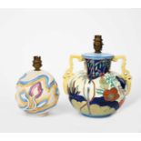 A Clarice Cliff lamp base, ovoid cast in low relief in stylised flowers, glazed in colours on a