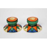 'Original Bizarre' a pair of Clarice Cliff Bizarre candlesticks, shape no.331, painted with