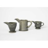 ‡ Walter Keeler (born 1942) a jug with beak spout, covered in a grey glaze, and two other jugs by