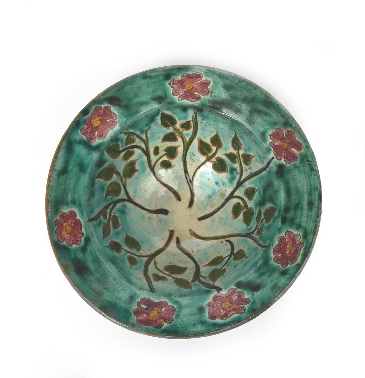 A small Della Robbia Pottery bowl by Tom Hall, painted with radiating flower stems in red and