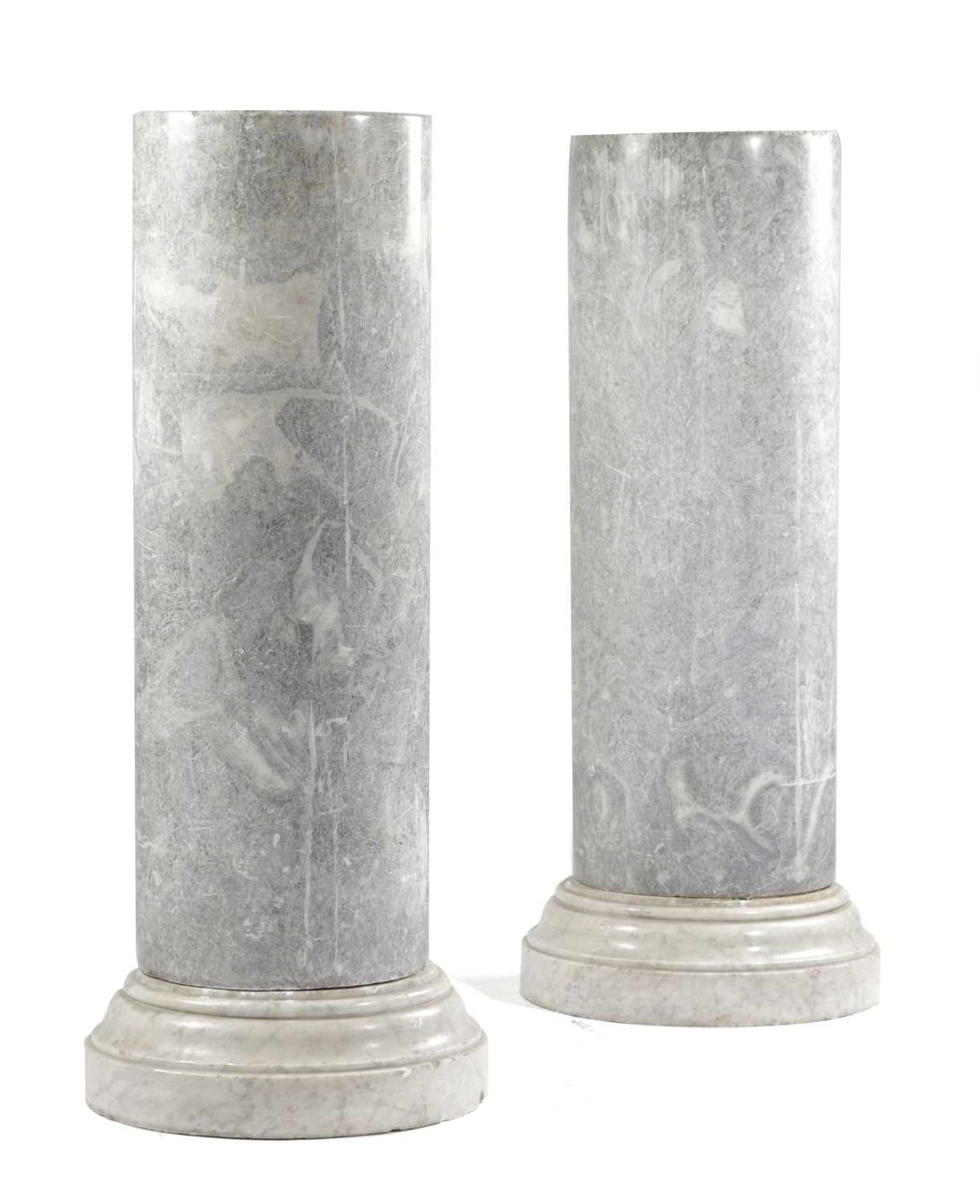 A PAIR OF GREY MARBLE COLUMNS 19TH CENTURY of cylindrical form, on white marble plinths (4) 105cm
