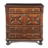 A WILLIAM AND MARY WALNUT CHEST LATE 17TH CENTURY with four long geometric panelled drawers, on