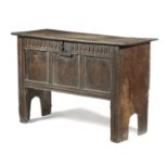 A CHARLES II BOARDED OAK COFFER C.1680 the hinged lid with thumbnail mouldings, the interior