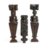 A PAIR OF OAK TERMS 17TH CENTURY the male and female busts beneath large flowers, with carved bodies