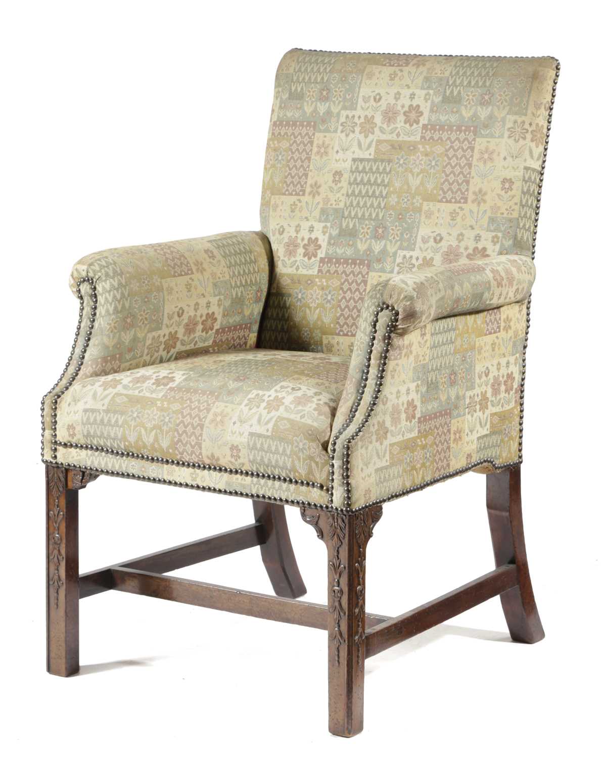 A GEORGE III MAHOGANY ARMCHAIR LATE 18TH CENTURY with later upholstery, the front legs carved with
