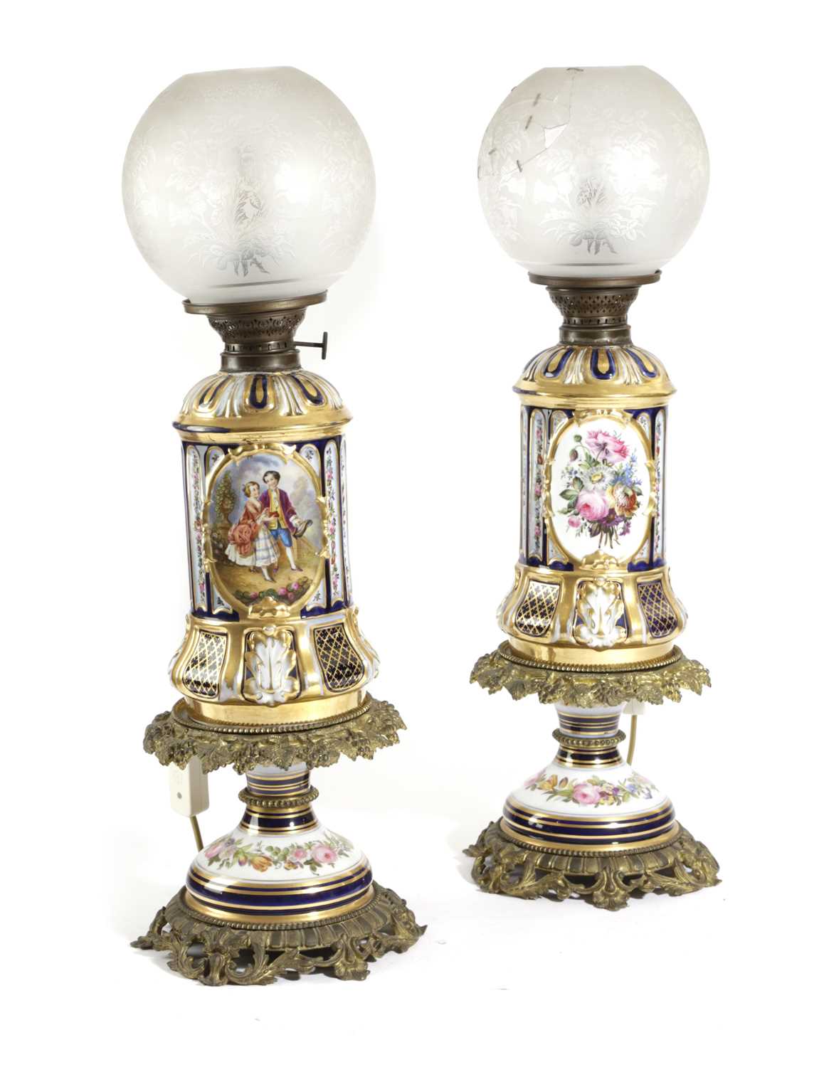 A PAIR OF FRENCH PORCELAIN AND GILT METAL OIL LAMPS LATE 19TH CENTURY each with a fluted body with