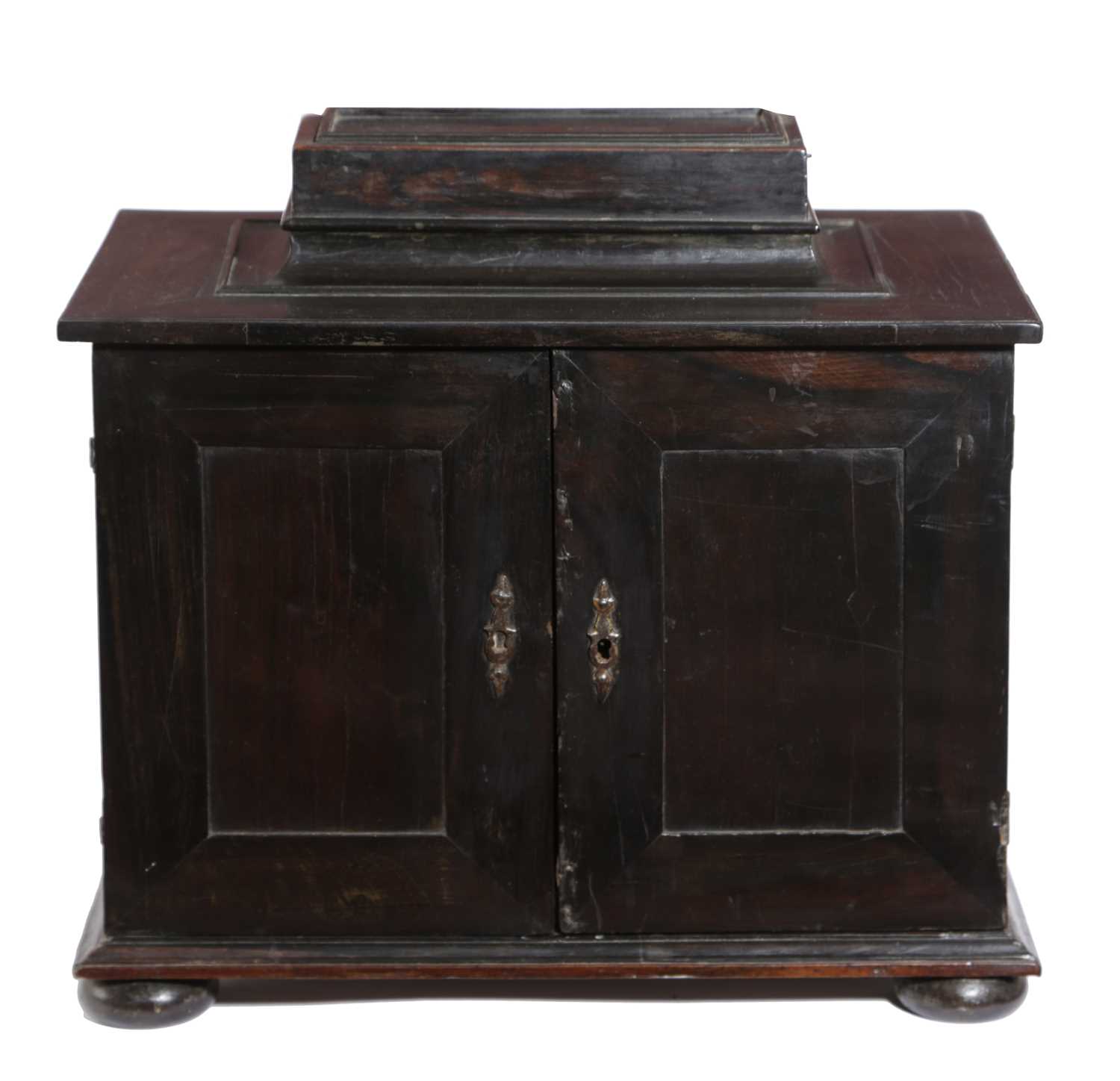 A FLEMISH EBONY TABLE CABINET LATE 17TH / EARLY 18TH CENTURY the raised top with a sliding cover
