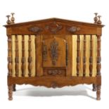 A FRENCH WALNUT FOOD HUTCH 19TH CENTURY ELEMENTS AND LATER with a hinged top, the classical pediment