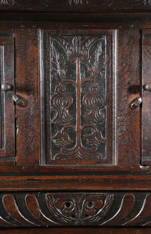 A CHARLES II OAK COURT CUPBOARD C.1680 carved with scrolling rondels and flowerheads, with a pair of - Image 2 of 2