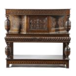 AN OAK STANDING LIVERY CUPBOARD POSSIBLY YORKSHIRE, MID-17TH CENTURY AND LATER carved with panels of