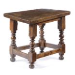 A SMALL WALNUT TABLE SPANISH OR ITALIAN, 17TH CENTURY AND LATER the thick plank top on turned and