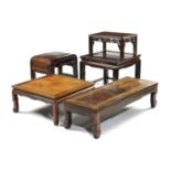 FIVE CHINESE HARDWOOD LOW TABLES 19TH / 20TH CENTURY each with a panelled top on scrolled feet (5)
