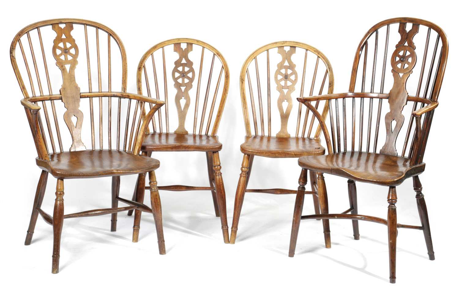 FOUR VICTORIAN WHEELBACK WINDSOR CHAIRS 19TH CENTRUY comprising: a yew and elm armchair with a