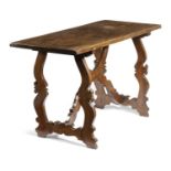 A SPANISH WALNUT REFECTORY TABLE 17TH / 18TH CENTURY the shaped open ends united by an 'X' stretcher
