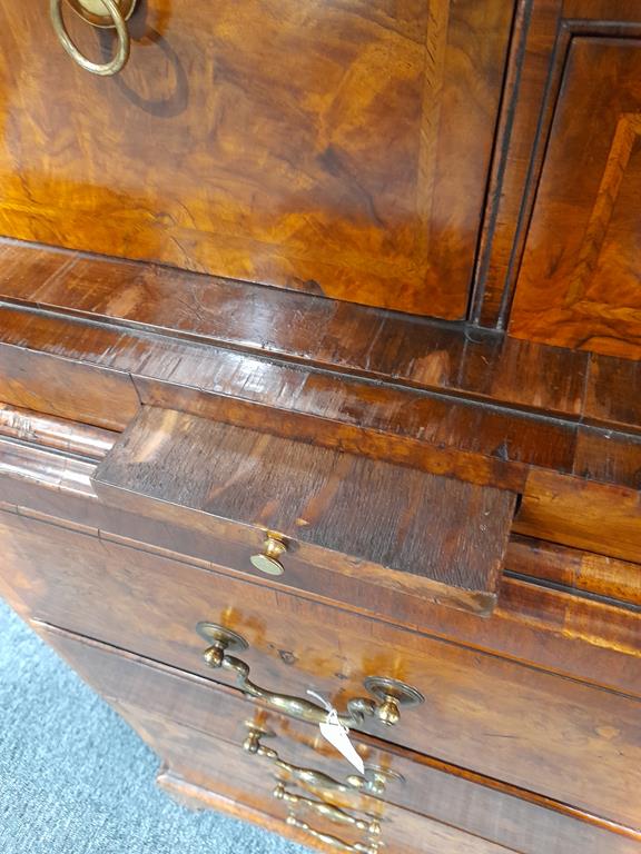 A GEORGE II BURR WALNUT AND WALNUT SECRETAIRE CABINET ON CHESTC.1730with cross and feather - Image 59 of 64