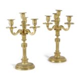 A PAIR OF FRENCH TRANSITIONAL GILT BRONZE FOUR LIGHT CANDELABRA ATTRIBUTED TO JEAN-CHARLES DELAFOSSE
