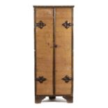 A CHESTNUT STANDING CORNER CUPBOARD POSSIBLY SPANISH, 18TH CENTURY AND LATER with a pair of damask