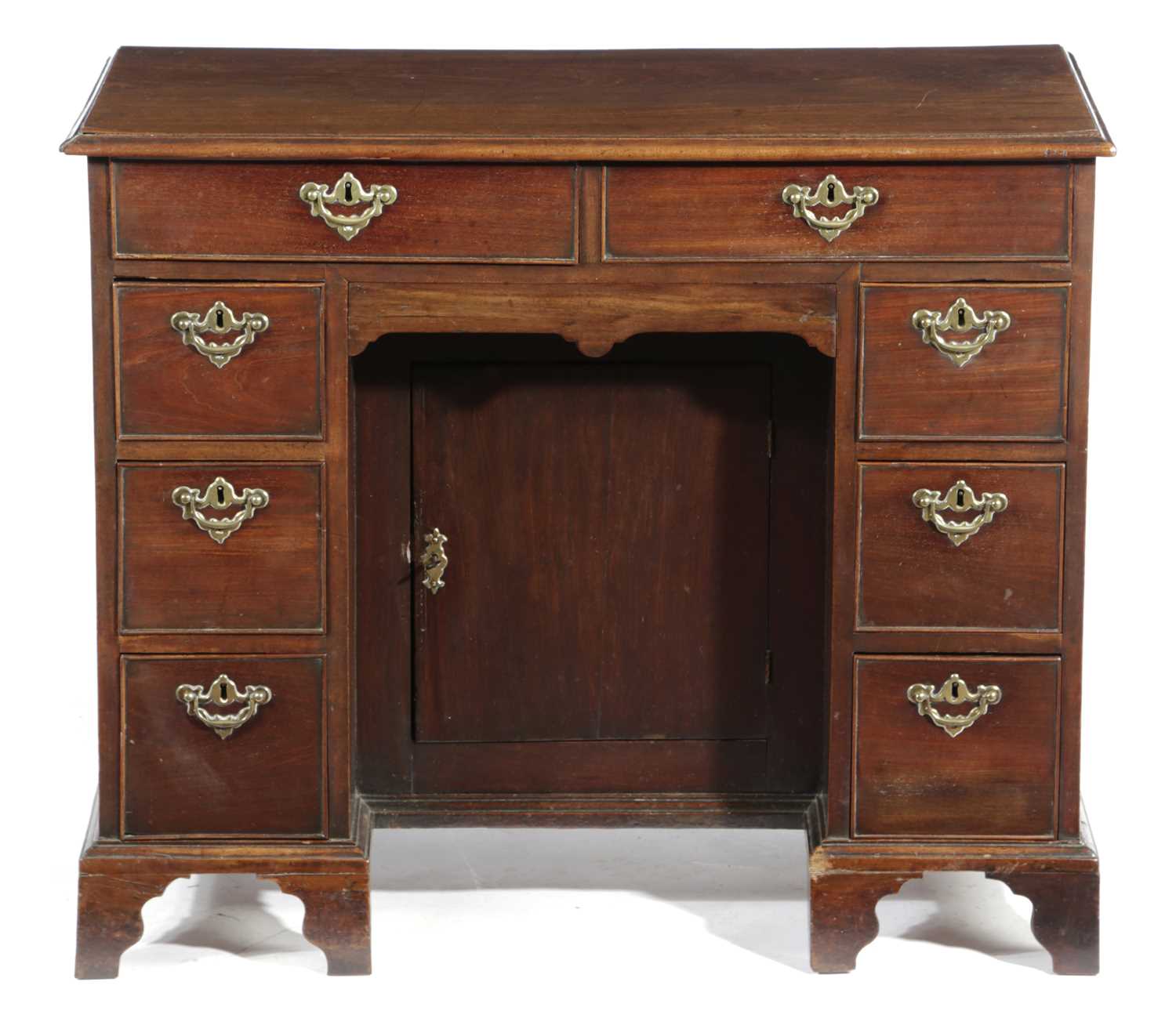 AN EARLY GEORGE III MAHOGANY KNEEHOLE DESK C.1760with an arrangement of nine drawers around a