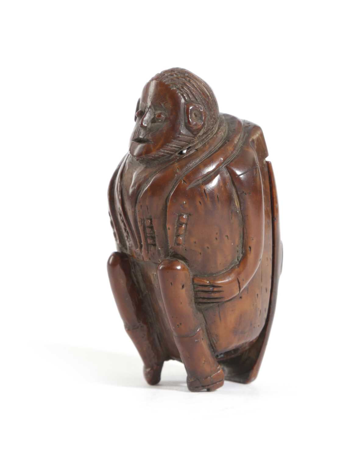 A CARVED COQUILLA NUT FIGURAL SNUFF BOX PROBABLY FRENCH, LATE 18TH / EARLY 19TH CENTURY as a