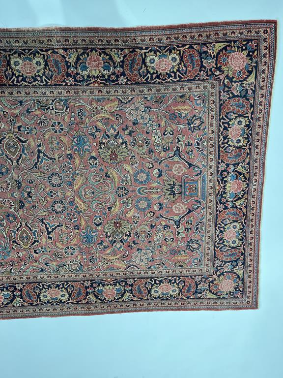 AN ISFAHAN RUG CENTRAL PERSIA, C.1960 the terracotta field of palmettes and scrolling vines enclosed - Image 23 of 26