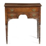 A REGENCY OAK LOWBOY EARLY 19TH CENTURY with three drawers and parquetry fan spandrels 78cm high,