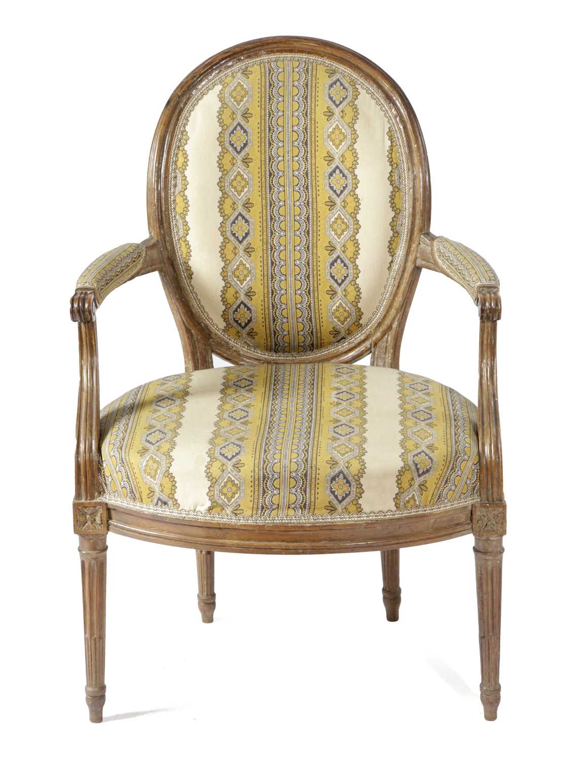 A FRENCH LOUIS XVI WALNUT FAUTEUIL 18TH CENTURY with an oval back and moulded frame, on stop-