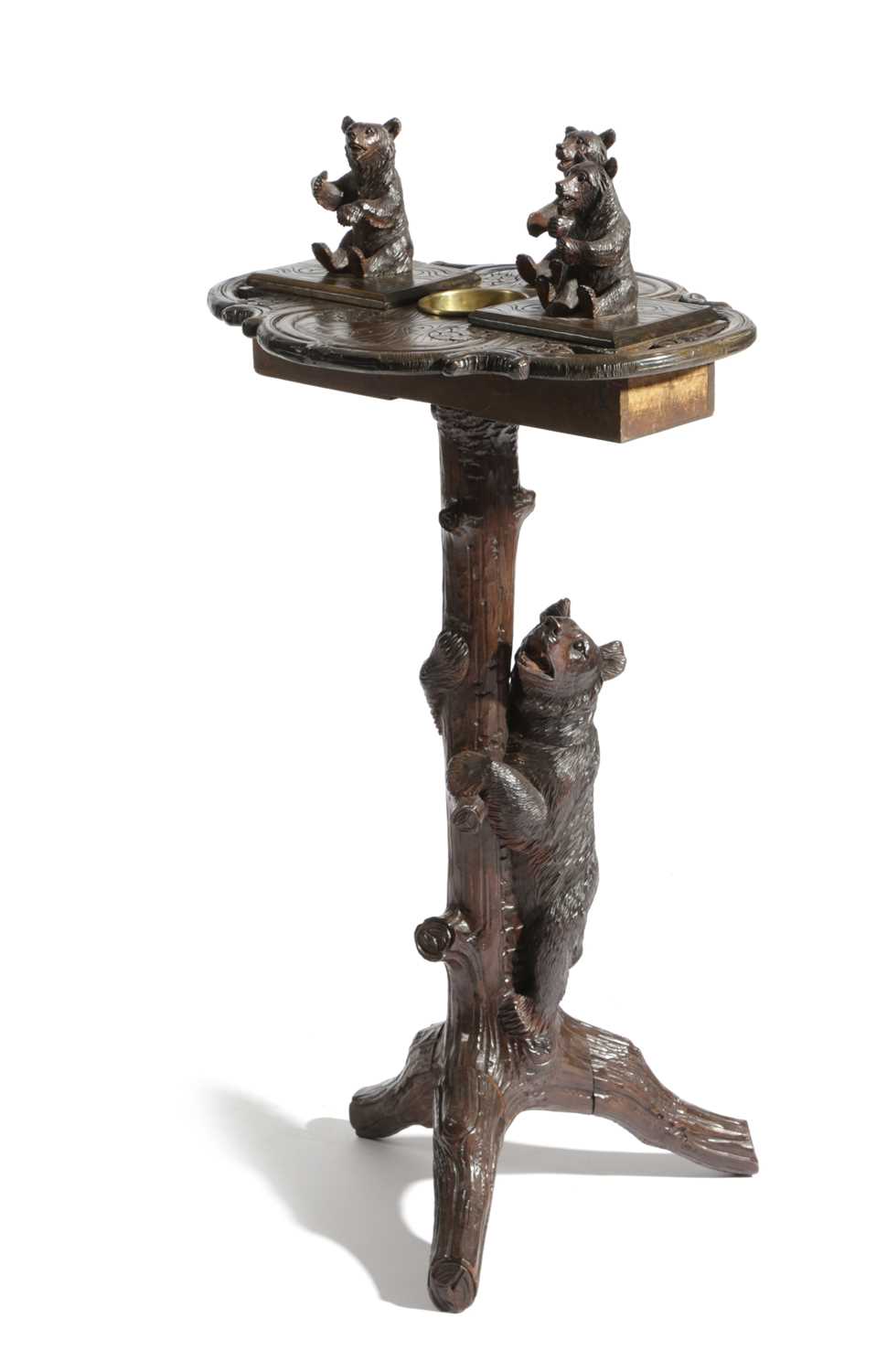 A BLACK FOREST LINDEN WOOD SMOKER'S COMPANION TABLE LATE 19TH CENTURY carved with a standing bear
