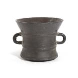 AN ENGLISH BRONZE MORTAR PROBABLY SOMERSET, 17TH CENTURY of slightly waisted form with two raised