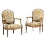 A PAIR OF FRENCH BEECHWOOD FAUTEUIL IN LOUIS XVI STYLE, 19TH CENTURY upholstered with floral