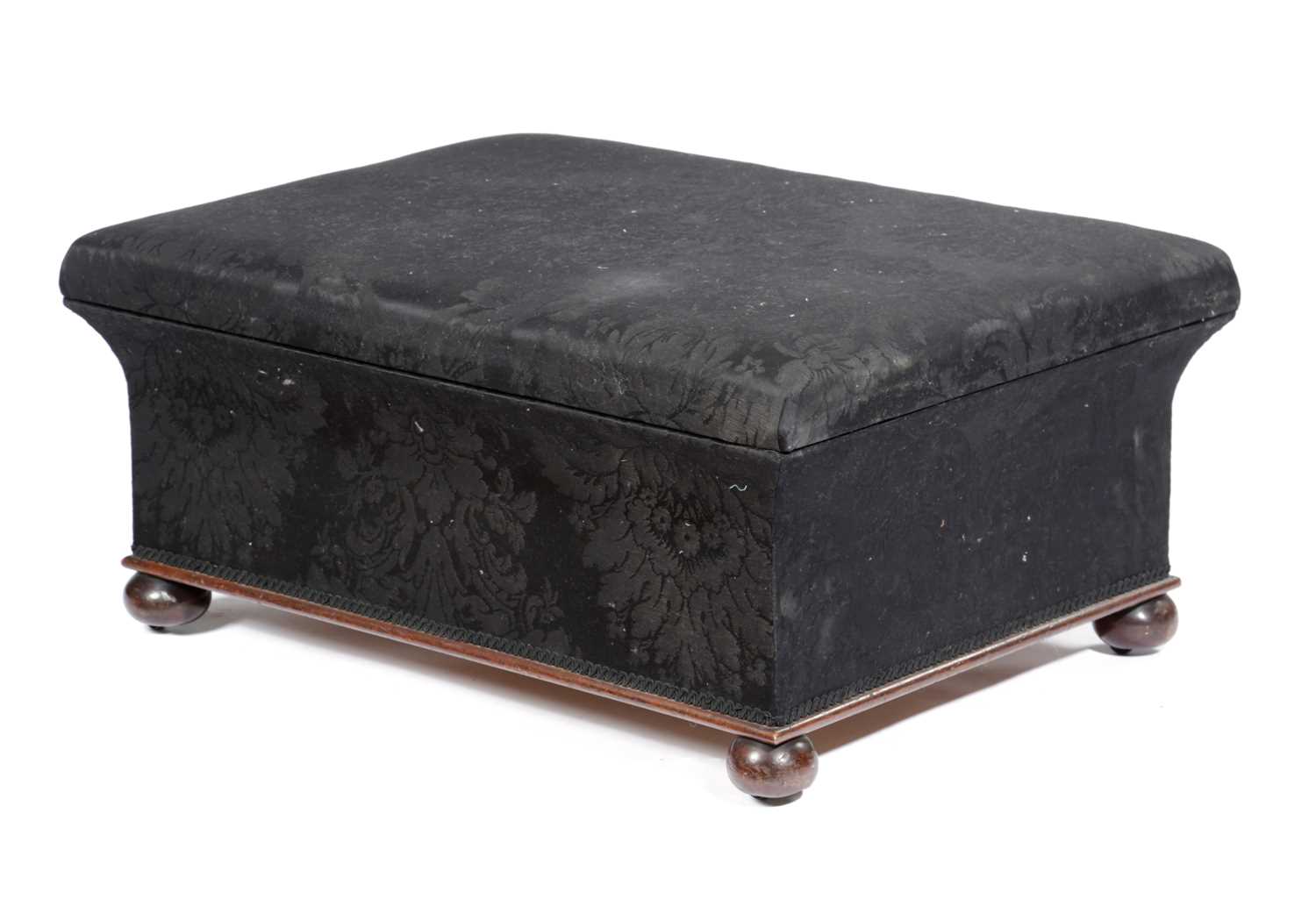 A VICTORIAN MAHOGANY OTTOMAN STOOL 19TH CENTURY covered in black silk damask, on bun feet with brass